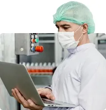 \nWorker diagnosing issues with a food manufacturing machine\n