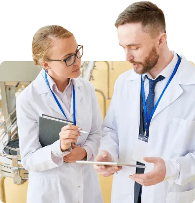 food production worker discussing production work with there manager