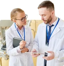 Senior manager talking to a college standing next to a food production line