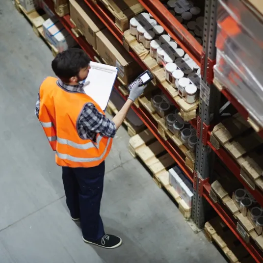 Storemen scanning items on shelf