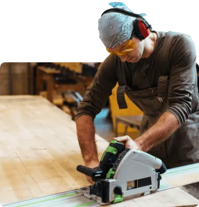 Carpenter using a electric saw to cut wood